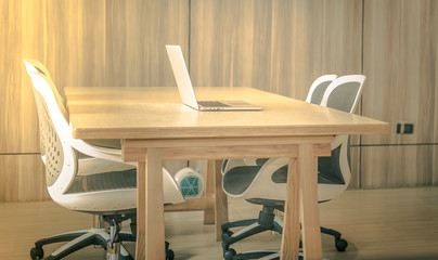 Office workplace with laptop, smart phone, cup of coffee on Comfortable work table, wood table