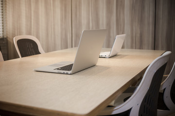 Office workplace with laptop, smart phone, cup of coffee on Comfortable work table, wood table