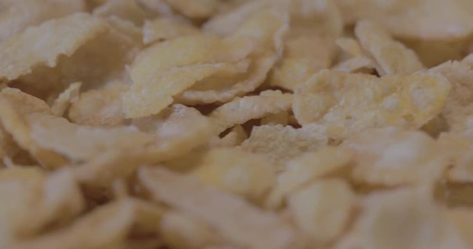 Corn-flakes background and texture, cornflake cereal box for morning breakfast.( 4k ungraded )