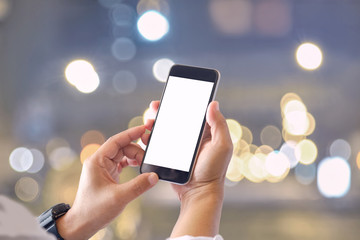 Mockup smartphone blank screen in man hands over blurred background.