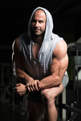 Attractive Young Man Resting In Gym Afther Exercise