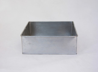 Square zinc mold cake on the white background. Metal archetype of cake and sweets isolated on white...