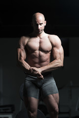 Man in Gym Showing His Well Trained Body