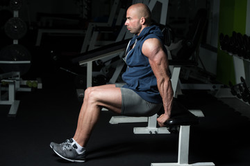 Fototapeta na wymiar Triceps Exercise On Bench In A Gym