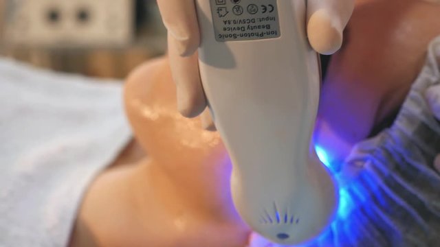 Skin Rejuvenation Treatment, Woman facial rejuvenation salon receive skin treatment.