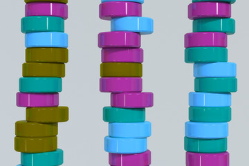 Pattern of blue, violet and green cylinder tablets on white background