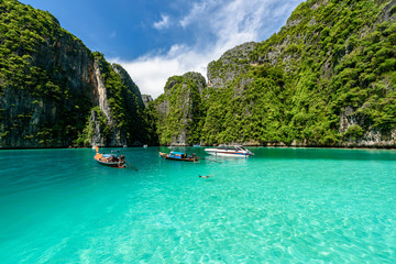 Beautiful crystal clear water at Pileh bay at Phi Phi island in Krabi near Phuket, Thailand. Concept for beach or sea in summer travel. - obrazy, fototapety, plakaty