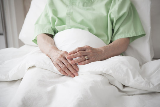 Elderly female patient under medical treatment