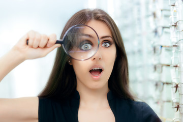 Funny Woman with Magnifying Glass Ready For Eye Exam