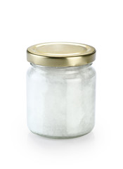 Glass jar with fresh coconut oil isolated on white background.