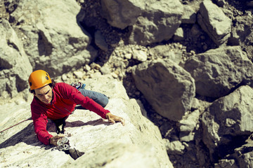 The climber makes an ascent to a large wall.