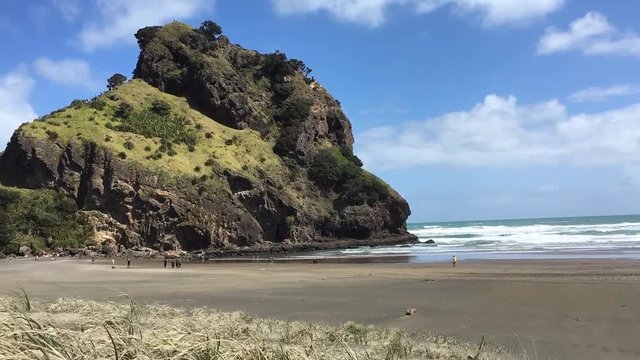 Time lapse landscape of the Lion rock on Piha beach in the Waitakere range near Auckland, New Zealand.