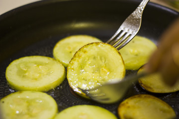 zucchini fried in a skillet