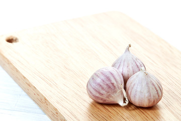 Fresh healthy garlic on white table