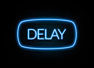 Delay  - colorful Neon Sign on brickwall