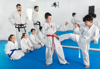Fototapeta na wymiar Pair of boys practicing new karate moves