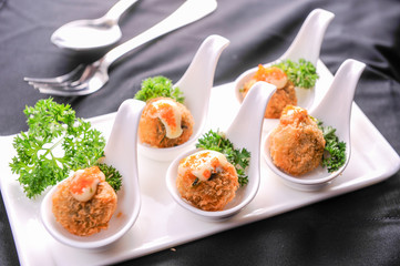 appetizer of meat ball and spawn on spoon