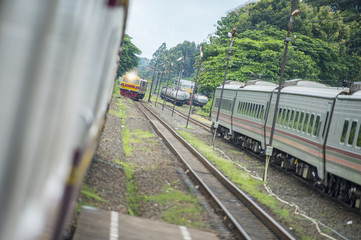 Naklejka premium Railway officials are managing train traffic in Thailand.