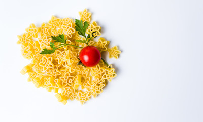 Uncooked pasta with ingredients on white