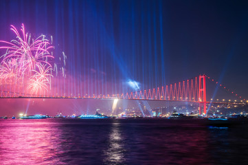 Naklejka na ściany i meble Fireworks over Istanbul Bosphorus during Turkish Republic Day celebrations. 15th July Martyrs Bridge (15 Temmuz Sehitler Koprusu). Istanbul, Turkey..