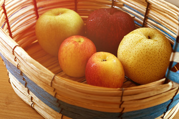 sunrise with apples in the basket.