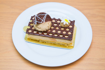 Coffee cake with chocolate in cafe
