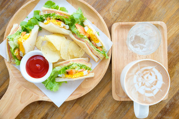 Club sandwich with mocha on the table