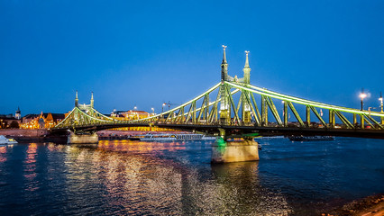 Szabadsag hid (Liberty Bridge or Freedom Bridge) in Budapest, Hungary connects Buda and Pest across the River Danube.