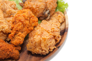 fried chickens on wooden plate