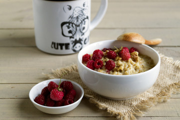 Breakfast with oatmeal and fresh raspberries.