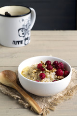 Breakfast with oatmeal and fresh raspberries.