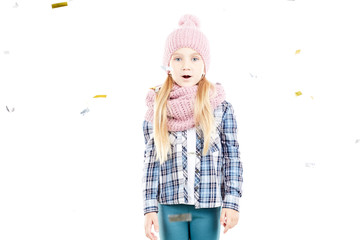 Studio portrait of little girl wearing knit hat and snood scarf