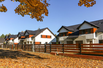 Picturesque newly built houses / suburban housing development on a beautiful autumn day 