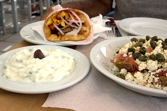 Tzatziki sauce, Gyros Pita and Dakos salad - Typical greek mediterranean dishes
