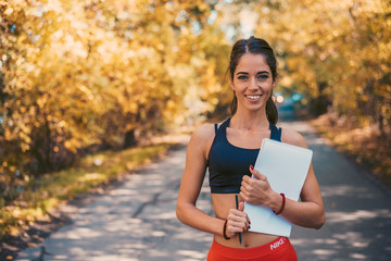 Female fitness instructor outdoor.