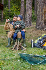 father and son in forest