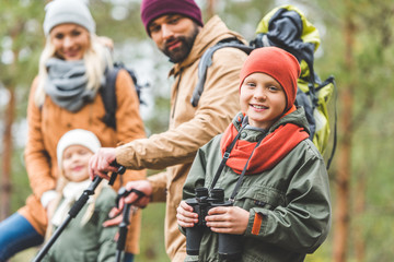 Fototapeta premium smiling boy with binoculars