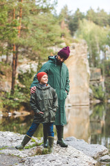 father and son in autumn forest