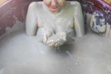 The girl in the mud bath. Concept of relaxation. Nha Trang, Vietnam.