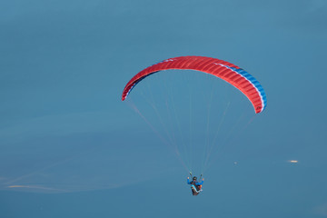 Parasailor floating on the light winds above the Bavarian valley