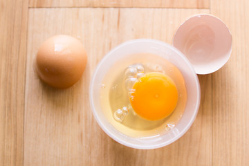 Fresh eggs in a cup and egg shell