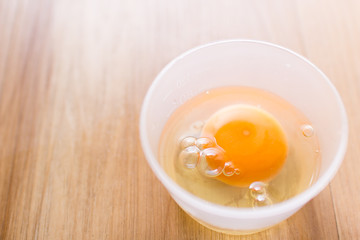 Fresh eggs in a cup