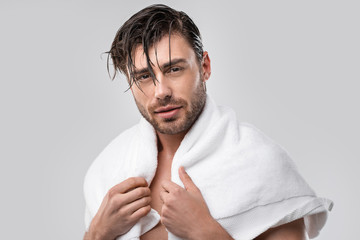 man with wet hair and towel