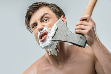 man shaving with ax