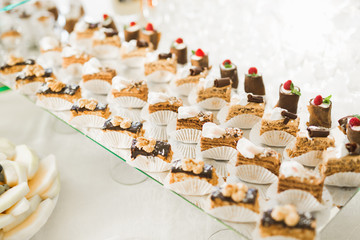 Different kinds of baked sweets on a buffet
