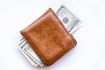 dollars bills in wallet on white