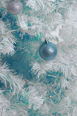 Christmas decoration ball blue. On a white Christmas tree. Bright bright decoration.