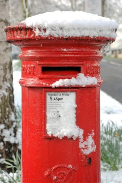 British postbox close up in snow