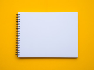 Notepad on yellow background