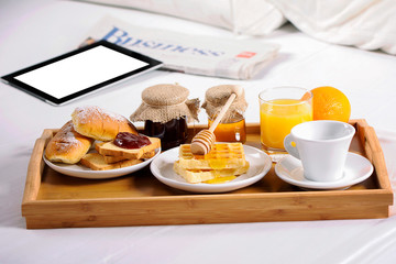 Breakfast in bed. Tray with coffee, croissants and fruits